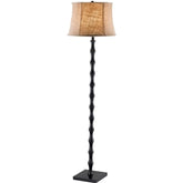 A modern black floor lamp topped with a beige shade, offering a warm and inviting glow to the space.